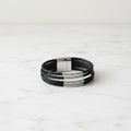 Multi-Strand Black Leather Bracelet with Silver Tube Accents